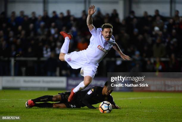 Sam Finley of AFC Fylde is awarded a penalty after Nathan Byrne of Wigan Athletic miss times his tackle during The Emirates FA Cup Second Round match...