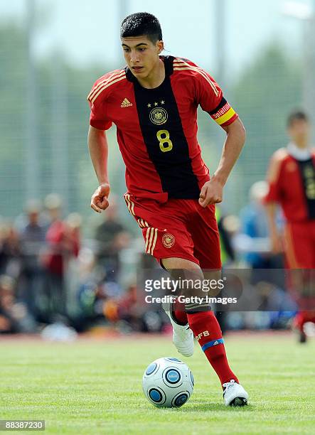 Emre Can of Germany runs with the ball during the U15 match between Germany and Poland at the Sportzentrum Niedergruendauer Street Stadium on June...