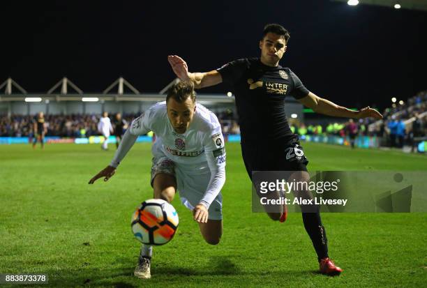 Jordan Richards of AFC Fylde and Reece James of Wigan Athletic compete for the ball during The Emirates FA Cup Second Round between AFC Fylde and...