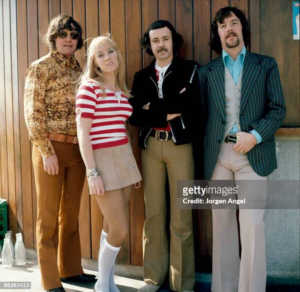 Eric McCredie, Sally Carr, Ken Andrew and Ian McCredie of the pop group Middle of The Road pose for a group shot in Hyde Park in 1972 in London.