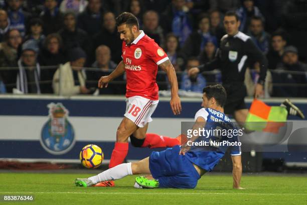 Benfica's Argentinian forward Toto Salvio with Porto's Spanish defender Ivan Marcano during the Premier League 2016/17 match between FC Porto and SL...
