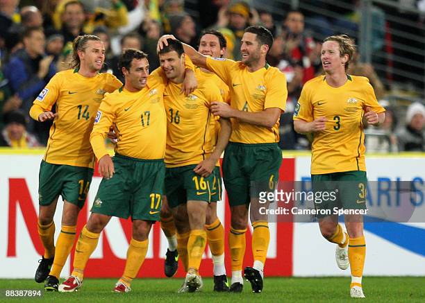 Socceroos players celebrate a goal by Mile Sterjovski during the 2010 FIFA World Cup Asian qualifying match between the Australian Socceroos and...