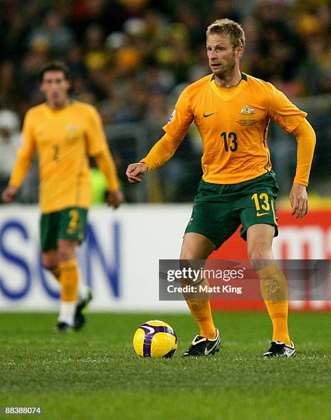 Vince Grella of the Socceroos controls the ball during the 2010 FIFA World Cup Asian qualifying match between the Australian Socceroos and Bahrain at...