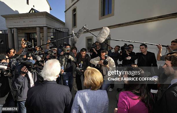 Stern family lawyer Marc Bonnant Stern's former separated wife Beatrice, Stern's daughter Mathilde and son Louis faces news cameramen and press...