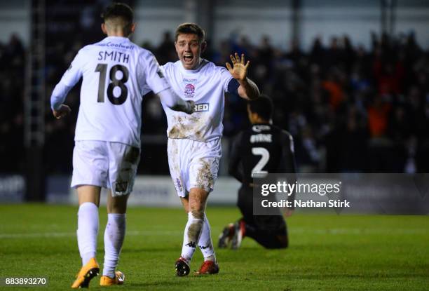 Sam Finley of AFC Fylde celebrates after he is awarded a penalty after Nathan Byrne of Wigan Athletic miss times a tackle during The Emirates FA Cup...