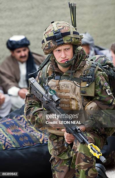 British First Infantry soldier takes part in a training exercise at a new "Afghan village" at a military base in Norfolk, in eastern England, on June...