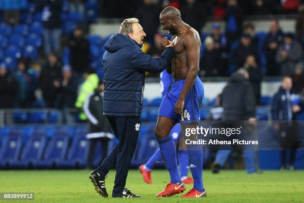 Cardiff City manager Neil Warnock laughs with Sol Bamba of Cardiff City after the final whistle of the Sky Bet Championship match between Cardiff...