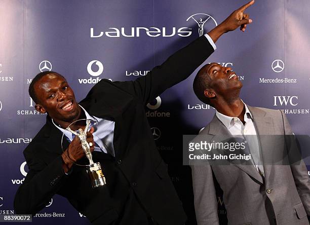 Usain Bolt World record holder for 100m and 200m, poses with Academy Member Michael Johnson after receiving the Laureus World Sportsman of the year...
