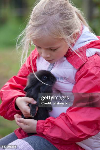 Girl Hugging Rabbit Photos and Premium High Res Pictures - Getty Images