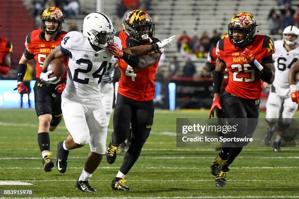 Maryland Terrapins defensive back Darnell Savage Jr. Grabs the face mask of Penn State Nittany Lions running back Miles Sanders on November 25 at...