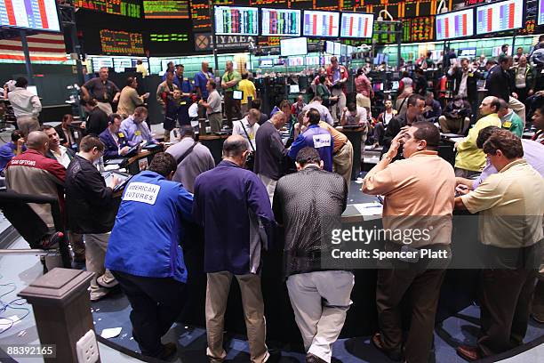 Traders in crude and and heating oil futures work on the floor of the New York Mercantile Exchange on June 10, 2009 in New York City. Crude futures...