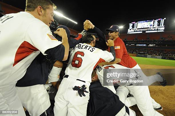 Team USA rush the field in celebration during the Pool 2 Game 5, of the second round of the 2009 World Baseball Classic at Dolphin Stadium in Miami,...