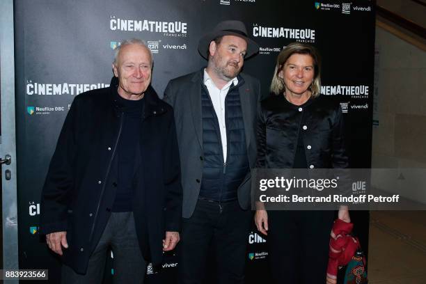 Director of the movie Xavier Beauvois standing between Producers of the movie, President of Pathe Jerome Seydoux and his wife Sophie the "Les...