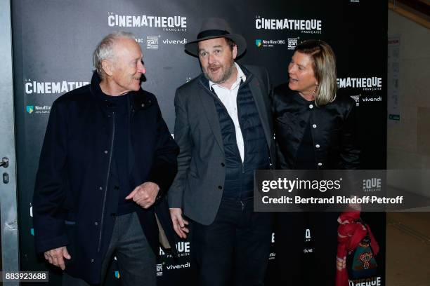 Director of the movie Xavier Beauvois standing between Producers of the movie, President of Pathe Jerome Seydoux and his wife Sophie the "Les...