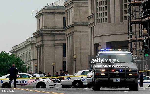 Police vehicles block 14th street in front of the Holocaust Museum June 10, 2009 in Washington, DC. According to reports, a gunman walked into the...