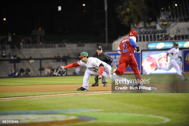 Adrian Gonzalez of Mexico makes the play at first base, getting out Eduardo Paret of Cuba during Pool 1 Game 3, of the second round of the 2009 World...