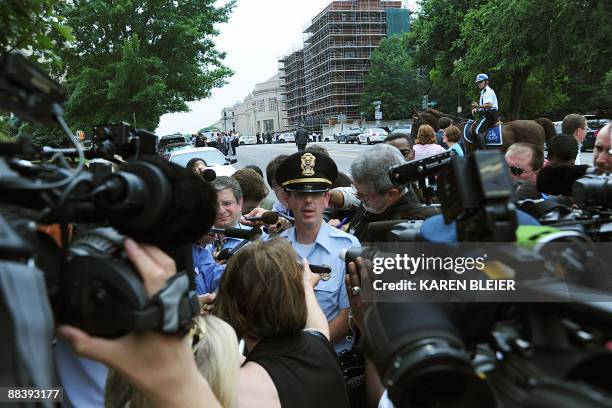 Park Police Sergeant David Schlosser speaks to the press outside the Holocaust Museum on June 10, 2009 in Washington, DC, after a shooting. Two...