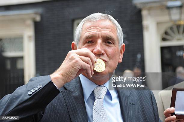 Norman Hunter kisses his medal, presented by Prime Minister Gordon Brown for representing his country in the 1966 World Cup on June 10, 2009 in...