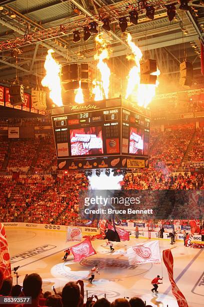 Fireworks go off as skaters carry flags around the ice prior to the start of Game Five of the 2009 NHL Stanley Cup Finals between the Pittsburgh...
