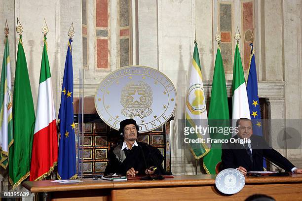 Libya's leader Muammar Gaddafi attends a meeting with Italian Prime Minister Silvio Berlusconi at Villa Madama on June 10, 2009 in Rome, Italy....