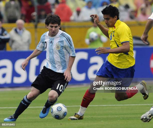 Argentina's forward Lionel Messi vies for the ball with Ecuador's midfielder Cristian Noboa during their FIFA World Cup South Africa-2010 qualifier...
