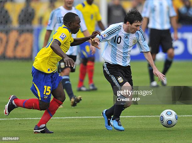 Argentina's forward Lionel Messi vies for the ball with Ecuador's midfielder Walter Ayovi during their FIFA World Cup South Africa-2010 qualifier...