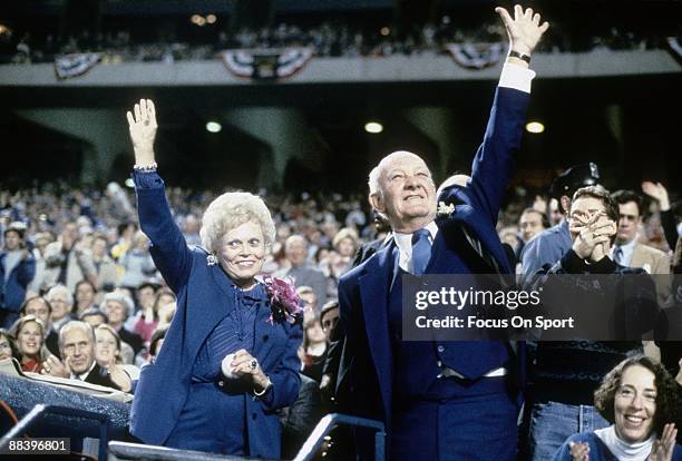Owner of the Kansas City Royals Ewing Kauffman and his wife Muriel Kauffman , waves to the fans prior to the start of a World Series game between the...