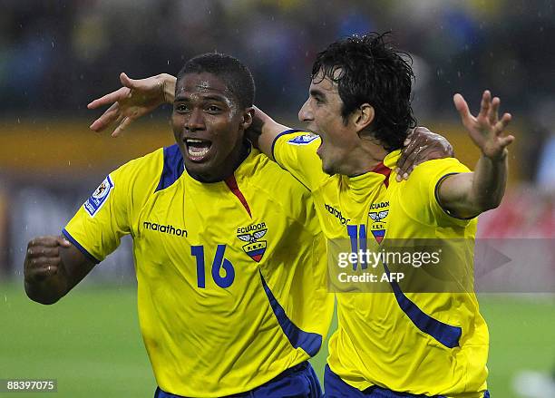 Ecuadorean national football players Pablo Palacios and Antonio Valencia celebrate after scoring against Argentina during their FIFA World Cup South...
