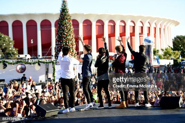 Sergio Calderon, Michael Conor, Drew Ramos, Brady Tutton and Chance Perez of In Real Life perform onstage at 102.7 KIIS FM's Jingle Ball Village at...