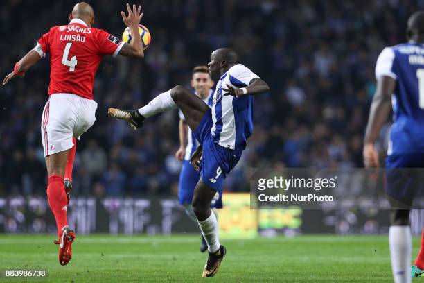 Porto's Cameroonian forward Vincent Aboubakar vies with Benfica's Brazilian defender Luisao during the Premier League 2016/17 match between FC Porto...