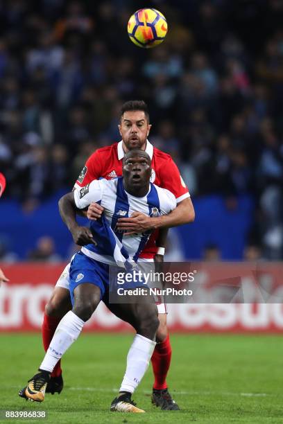 Porto's Cameroonian forward Vincent Aboubakar vies with Benfica's Brazilian defender Jardel during the Premier League 2016/17 match between FC Porto...