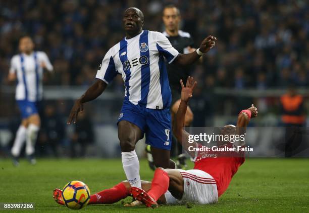 Porto forward Vincent Aboubakar from Cameroon tackled by SL Benfica defender Luisao from Brazil during the Primeira Liga match between FC Porto and...