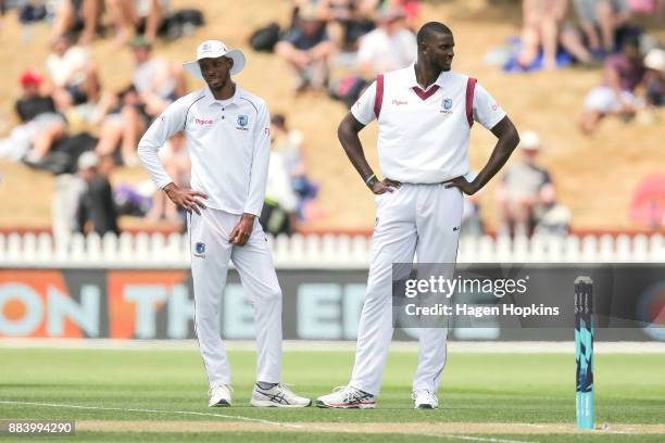 Roston Chase and Jason Holder of the West Indies look on in disappointment after Henry Nicholls of New Zealand is ruled not out during day two of the...