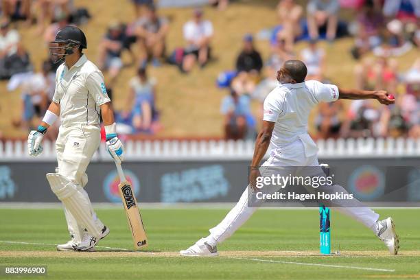 Shannon Gabriel of the West Indies bowls while Ross Taylor of New Zealand bats during day two of the Test match series between New Zealand Blackcaps...