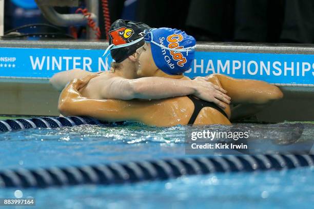 Mallory Comerford of the University of Louisville is congratulated by Isabel Ivey of Gator Swim Club after winning the A-Final of the women's 200...