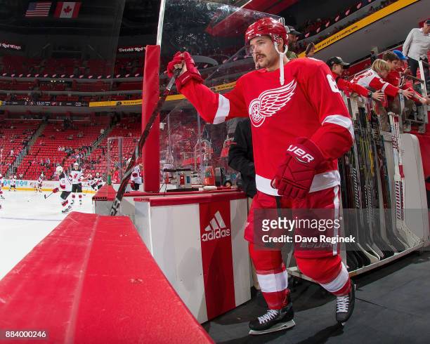 Xavier Ouellet of the Detroit Red Wings walks out for warm ups prior to an NHL game against the New Jersey Devils at Little Caesars Arena on November...