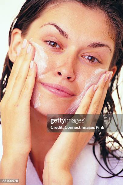 facial cleansing - facial cleanser stock pictures, royalty-free photos & images