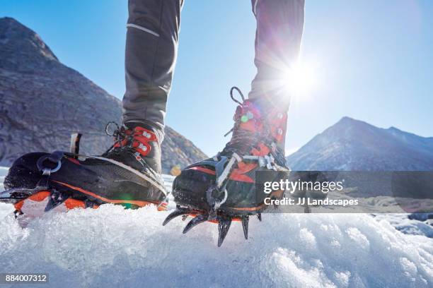 close up of crampons on ice, aletsch glacier, switzerland - aletsch glacier stock pictures, royalty-free photos & images