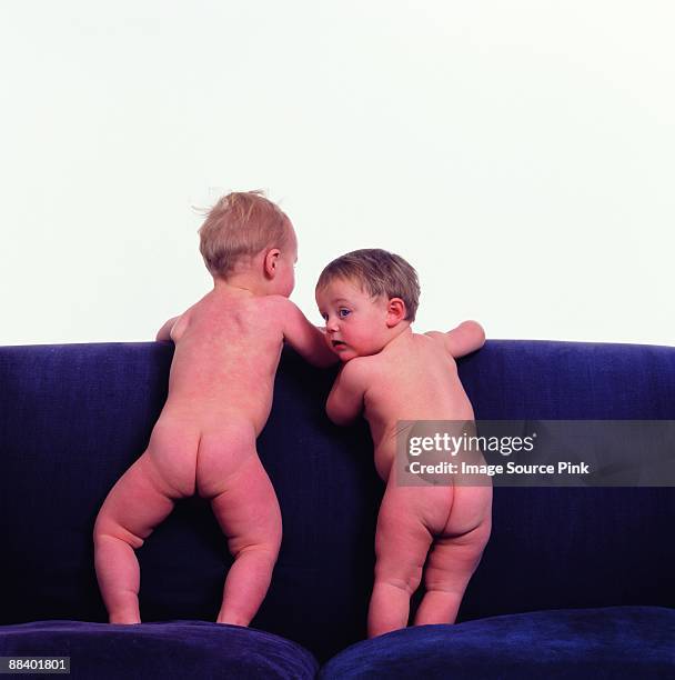 two babies - boys bare bum stock pictures, royalty-free photos & images