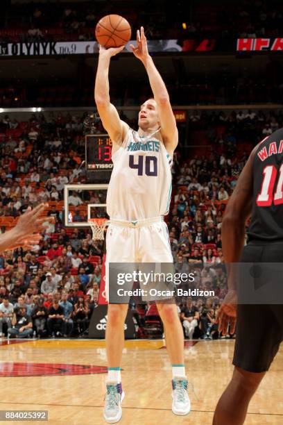 Cody Zeller of the Charlotte Hornets shoots the ball against the Miami Heat on December 1, 2017 at American Airlines Arena in Miami, Florida. NOTE TO...