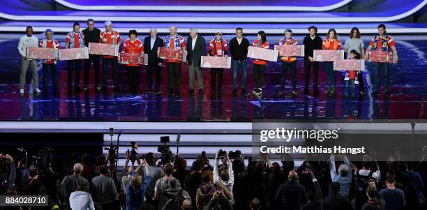 Cafu, Laurent Blanc, Nikita Simonyan, Gordon Banks, Fabio Cannavaro, Diego Forlan and Carles Puyol pose with the Super Fans from the host cities...