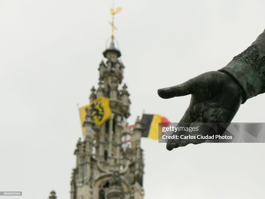Hand of sculpture showing the flags of Belgium and Flanders in Antwerp