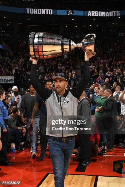 Ricky Ray of the Toronto Argonauts holds the Grey Cup at the game between the Indiana Pacers and the Toronto Raptors on December 1, 2017 at the Air...