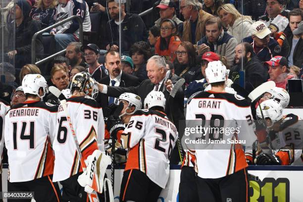 Head Coach Randy Carlyle of the Anaheim Ducks instructs his players during a timeout in the third period of a game against the Columbus Blue Jackets...