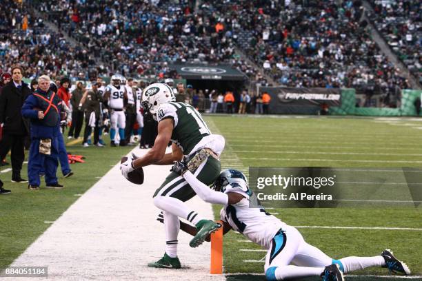 Wide Receiver Jermaine Kearse of the New York Jets scores a Touchdown against the Carolina Panthers during their game at MetLife Stadium on November...