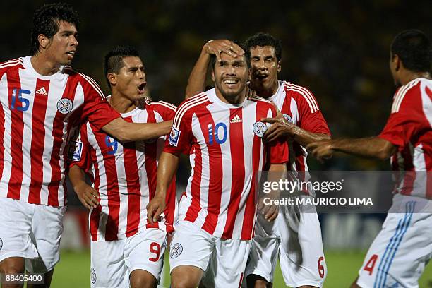 Paraguay's Salvador Cabanas celebrates his goal against Brazil with teammates Victor Caceres, Osvaldo Martinez, Carlos Bonet and Denis Caniza during...