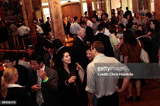 Job seekers and recruiters mingle during a Wall Street Pink Slip Party at City Winery June 10, 2009 in New York City. The periodic gatherings at bars...