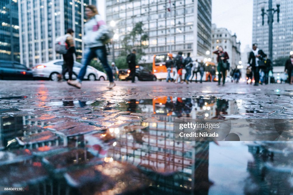 Puddle reflection view to the streets of downtown São Paulo, Brazil