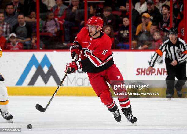 Marcus Kruger of the Carolina Hurricanes passes the puck during an NHL game against the Nashville Predators on November 26, 2017 at PNC Arena in...