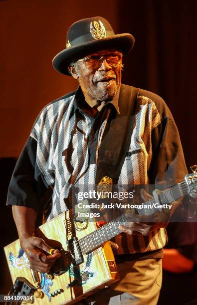 American Blues, R&B, and Rock musician Bo Diddley plays guitar with his group, the Bo Diddley Reunion Band, on the Petrillo Music Shell stage at the...